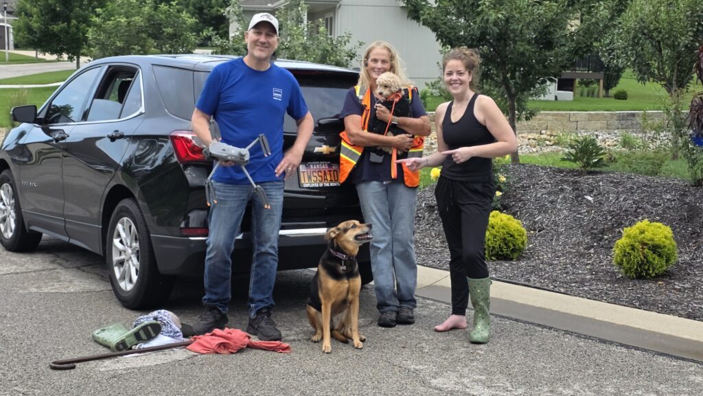 Callie back with her family and the KC Pet Search & Rescue team after her recovery in Olathe, Kansas